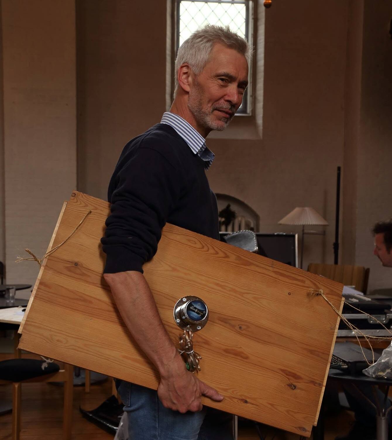 Niels Rosing-Schow with the wooden resonating plate with transducers used in FlashNight